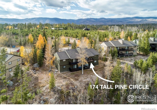 birds eye view of property with a mountain view