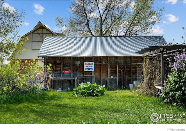 view of outbuilding with a yard