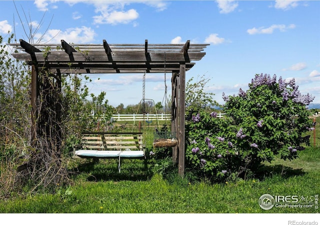 view of property's community featuring a pergola