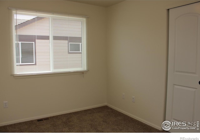 view of carpeted spare room