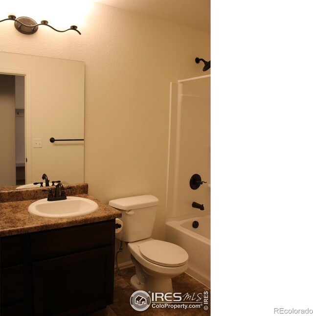 full bathroom with  shower combination, vanity, toilet, and tile patterned floors