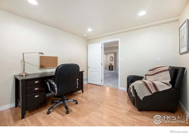 home office featuring light hardwood / wood-style floors