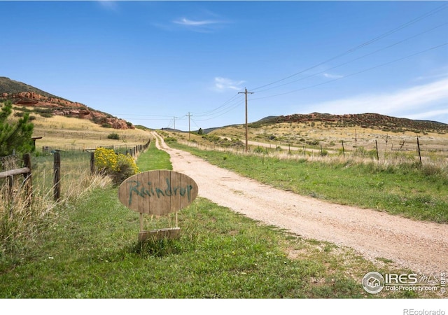 view of road featuring a mountain view and a rural view