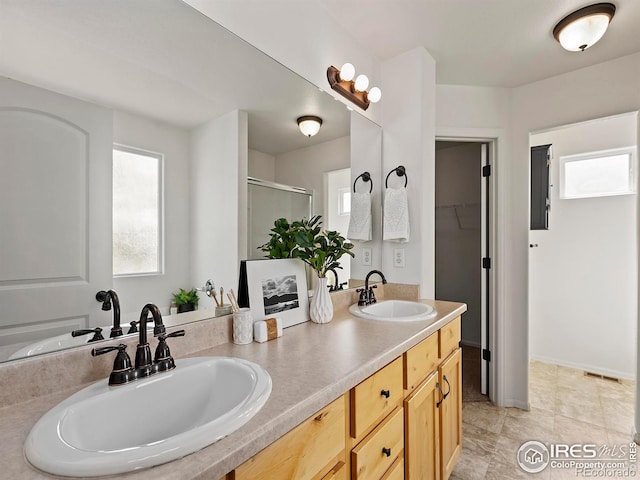 bathroom with vanity and walk in shower