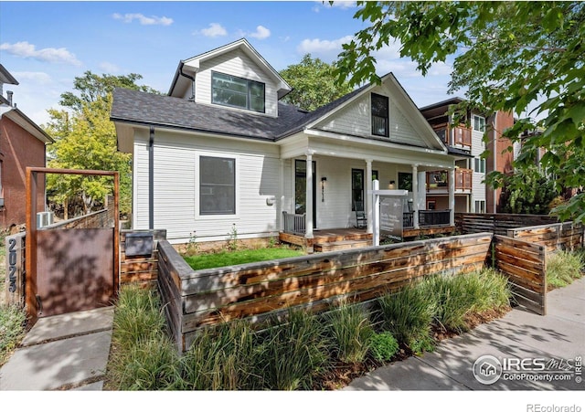 view of front of property with a balcony and a porch