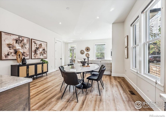 dining room featuring light wood-type flooring