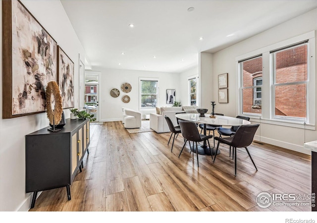 dining space featuring light hardwood / wood-style flooring