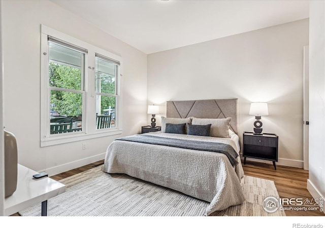 bedroom featuring wood-type flooring