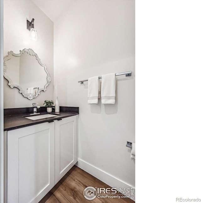 bathroom featuring vanity and hardwood / wood-style flooring