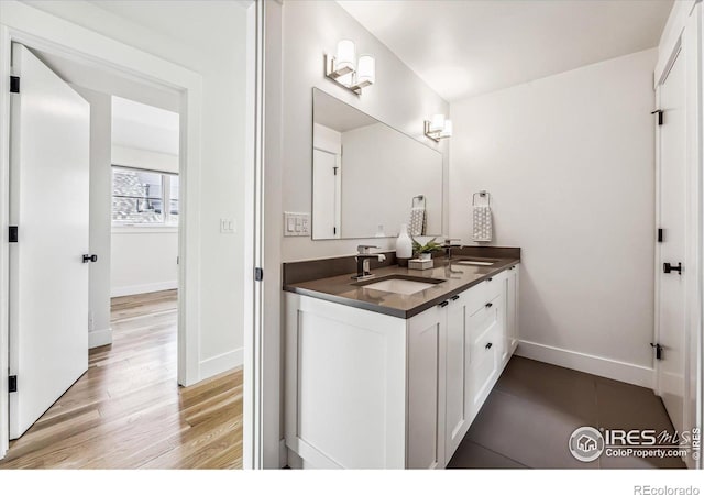 bathroom featuring vanity and wood-type flooring