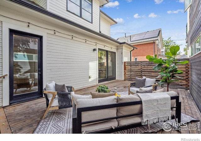 wooden deck featuring an outdoor hangout area