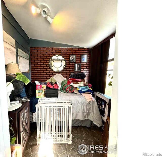 bedroom with vaulted ceiling