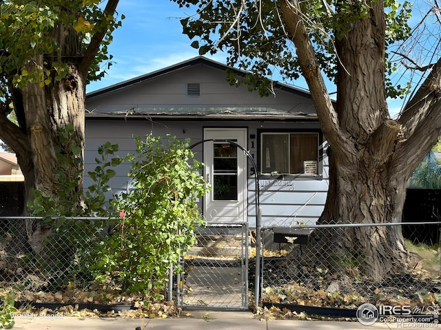 view of front of property with a gate and a fenced front yard