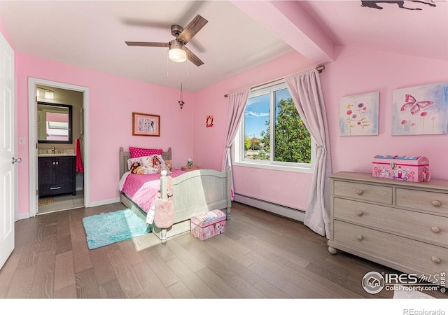 bedroom with a ceiling fan, a sink, connected bathroom, baseboard heating, and dark wood-style flooring