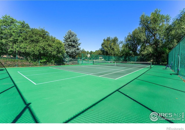 view of sport court with fence