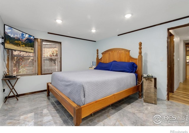 bedroom with crown molding