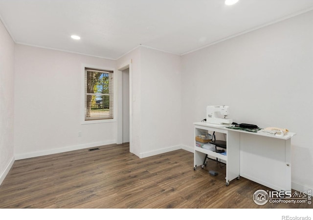 office area featuring crown molding and dark wood-type flooring