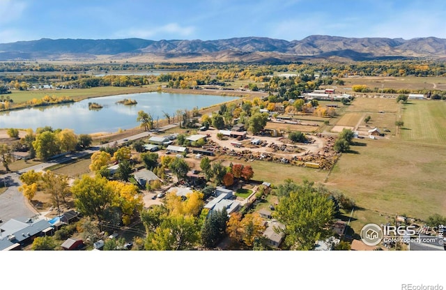 birds eye view of property featuring a water and mountain view