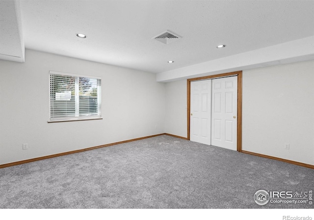 unfurnished bedroom with a closet and carpet