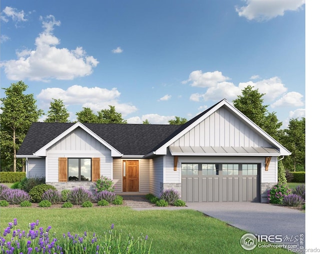 view of front of property with a garage and a front lawn