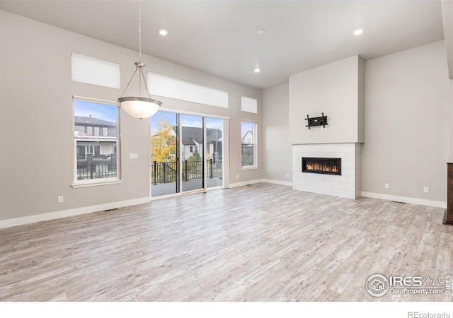 unfurnished living room with light hardwood / wood-style flooring