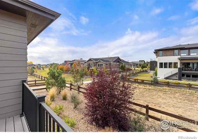 view of yard with a balcony