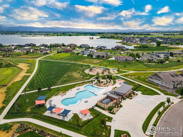 drone / aerial view featuring a water and mountain view