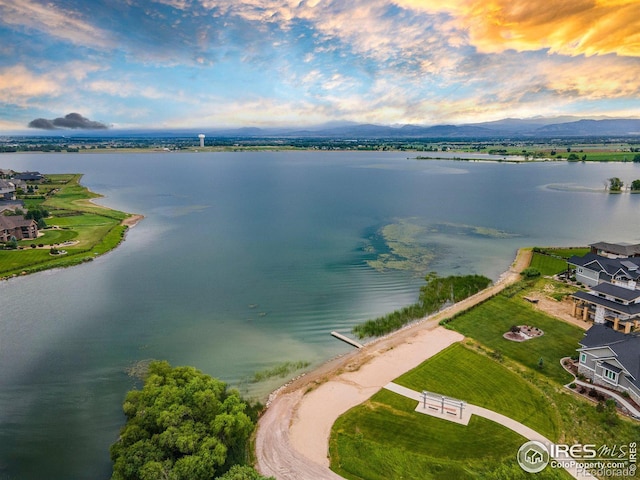 aerial view at dusk with a water and mountain view