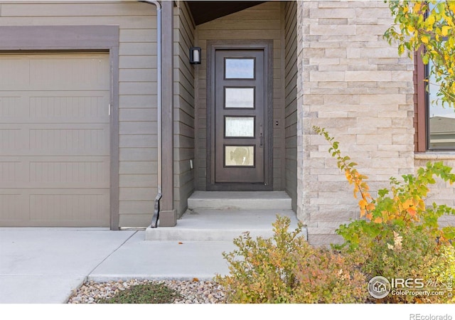 entrance to property featuring a garage