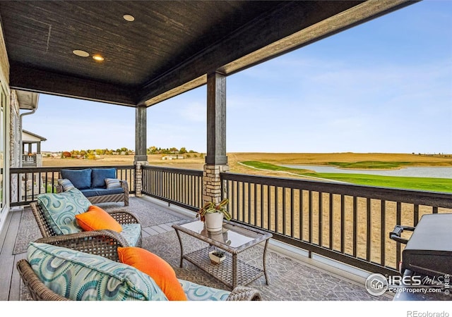 wooden terrace featuring outdoor lounge area