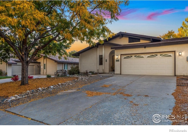 ranch-style house featuring a garage