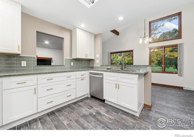 kitchen with dishwasher, kitchen peninsula, vaulted ceiling, dark hardwood / wood-style flooring, and white cabinetry