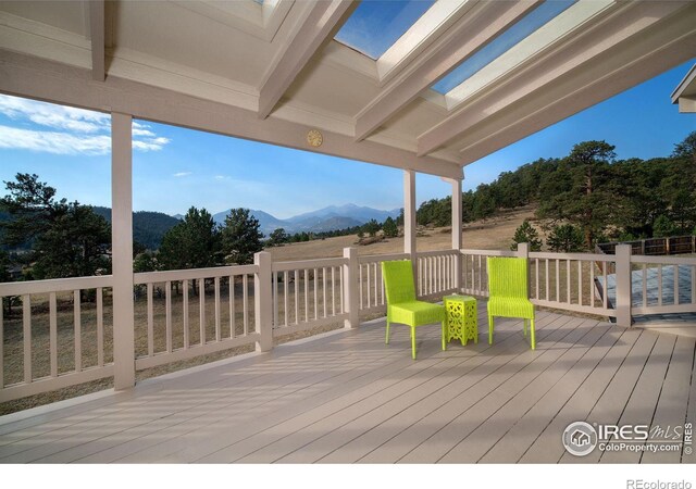 wooden terrace featuring a mountain view