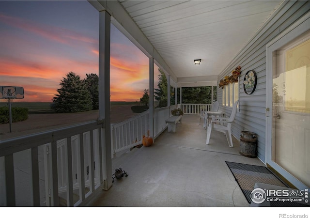 patio terrace at dusk with covered porch