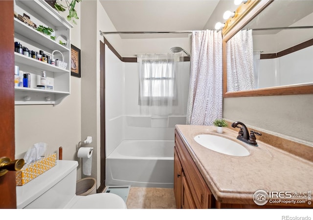 full bathroom with vanity, toilet, and shower / tub combo