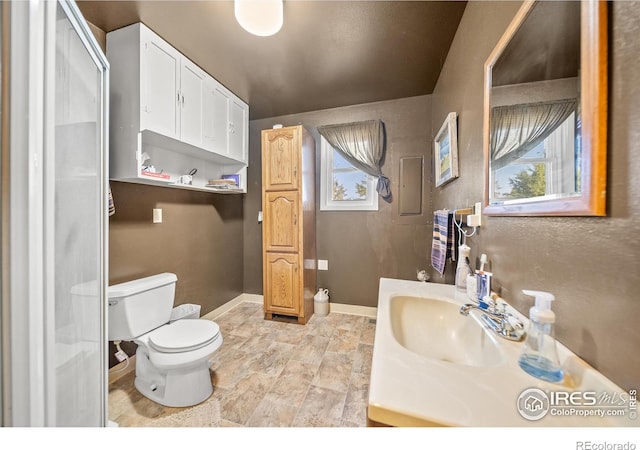 bathroom with toilet and vanity