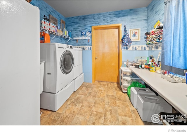 washroom with independent washer and dryer