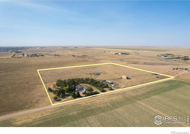 birds eye view of property featuring a rural view