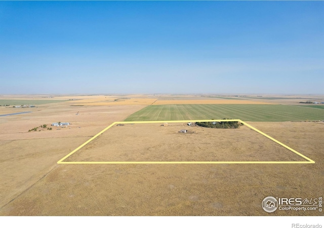 birds eye view of property with a rural view