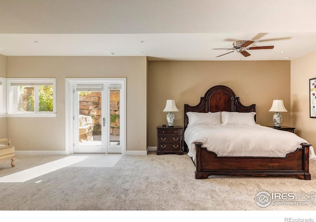 bedroom featuring light carpet, access to outside, and ceiling fan