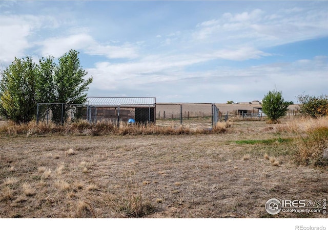 view of yard with a rural view