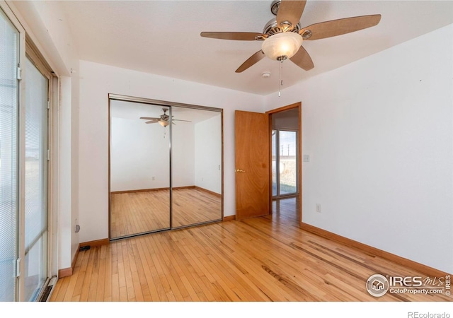 unfurnished bedroom with a closet, ceiling fan, and light hardwood / wood-style flooring