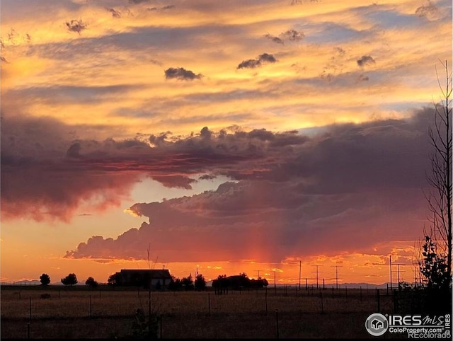 nature at dusk featuring a rural view