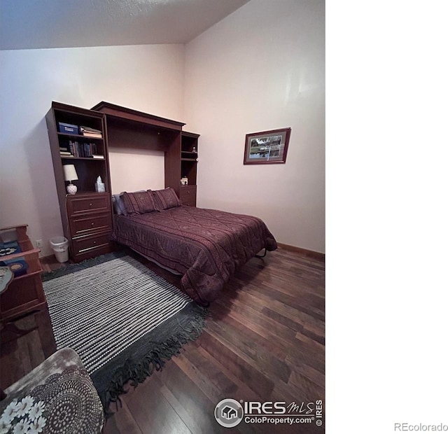 bedroom featuring wood finished floors