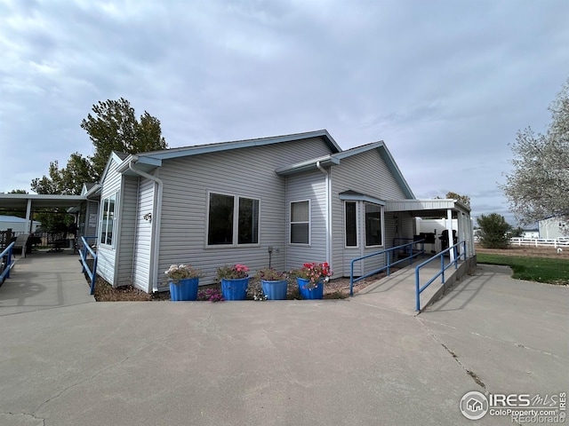 exterior space with a carport