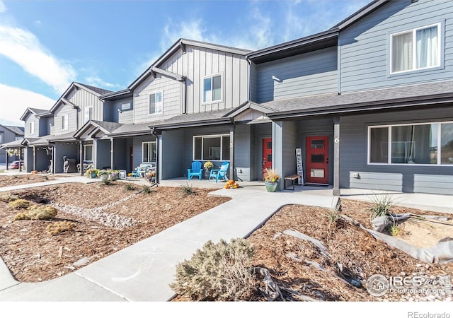 townhome / multi-family property with covered porch