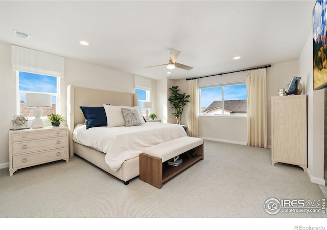 bedroom featuring ceiling fan and light carpet