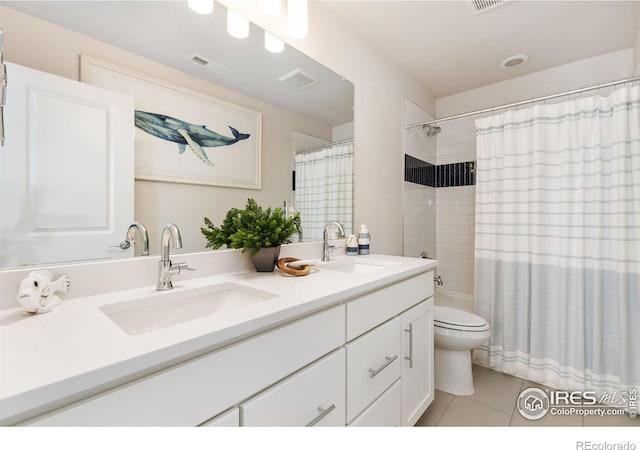 bathroom featuring toilet, a shower with curtain, vanity, and tile patterned floors