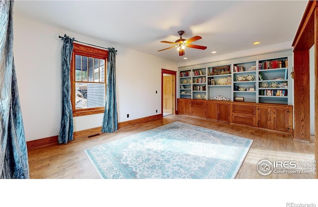 interior space with ceiling fan and light wood-type flooring