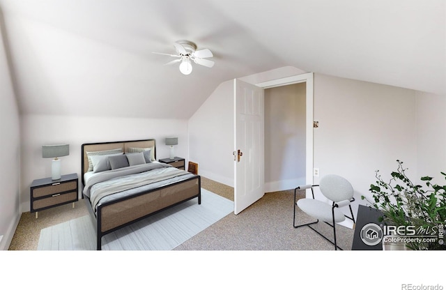 bedroom with ceiling fan, lofted ceiling, and light carpet